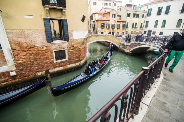 traditional-canal-street-with-gondola-venice-city-italy_231208-7697