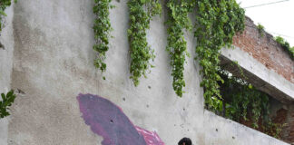 Lo street artist Bifido a IDoLove Urban Art Festival Bifido, lo street artist nel corso della realizzazione di una sua opera